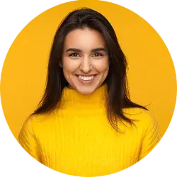 Team member smiling with yellow background